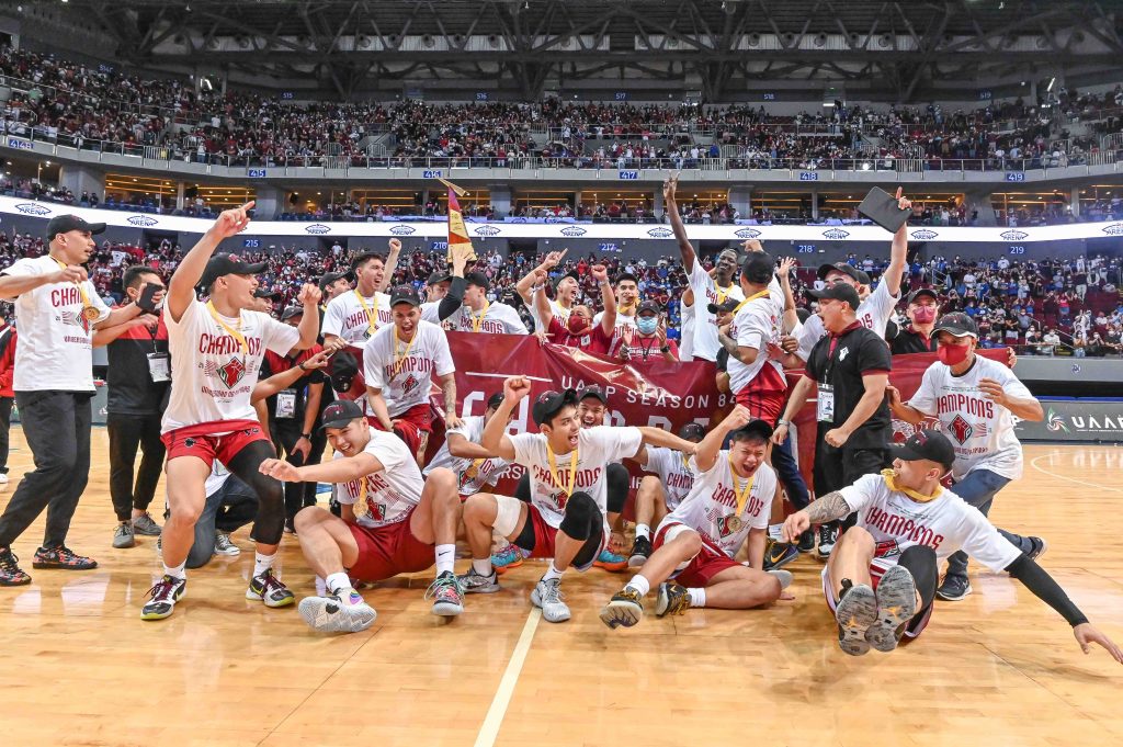 The UP Fighting Maroons celebrate after winning the UAAP Season 84 Men's Basketball tournament over the Ateneo Blue Eagles in overtime, 72-69. [photo credit: UAAP Media Group]